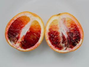 A blood orange cut in half