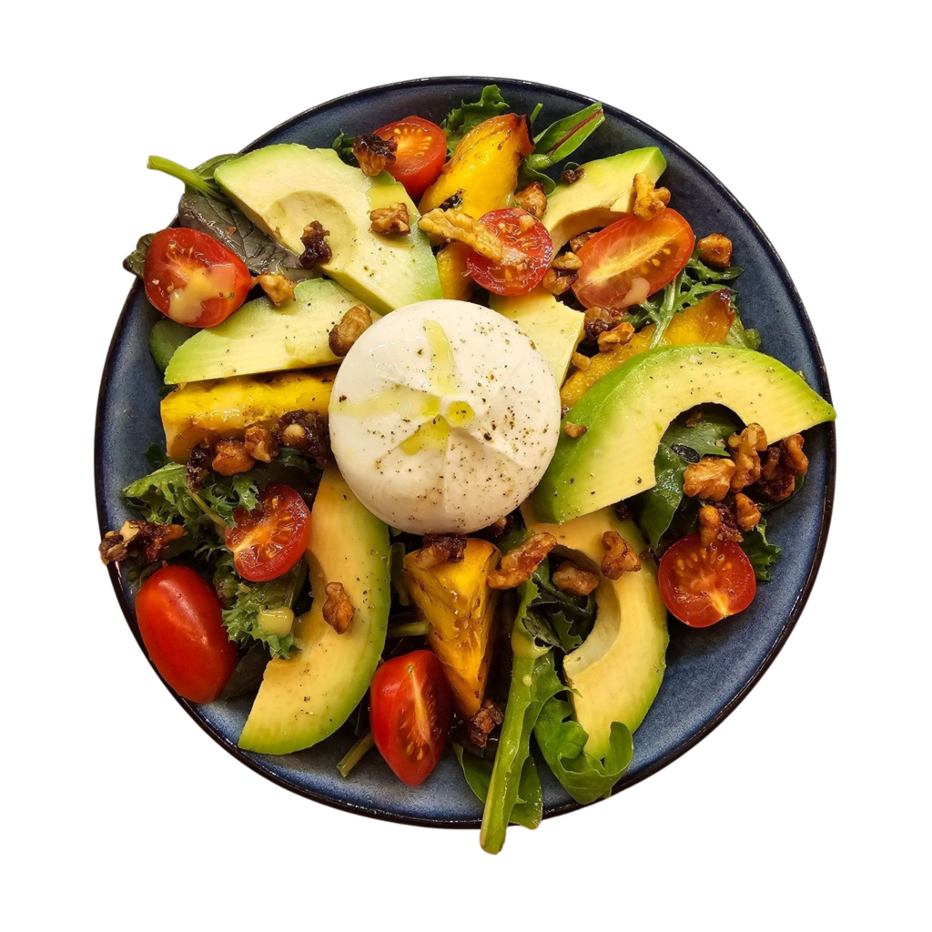 Colorful burrata salad with avocado, cherry tomatoes, and arugula on a plate